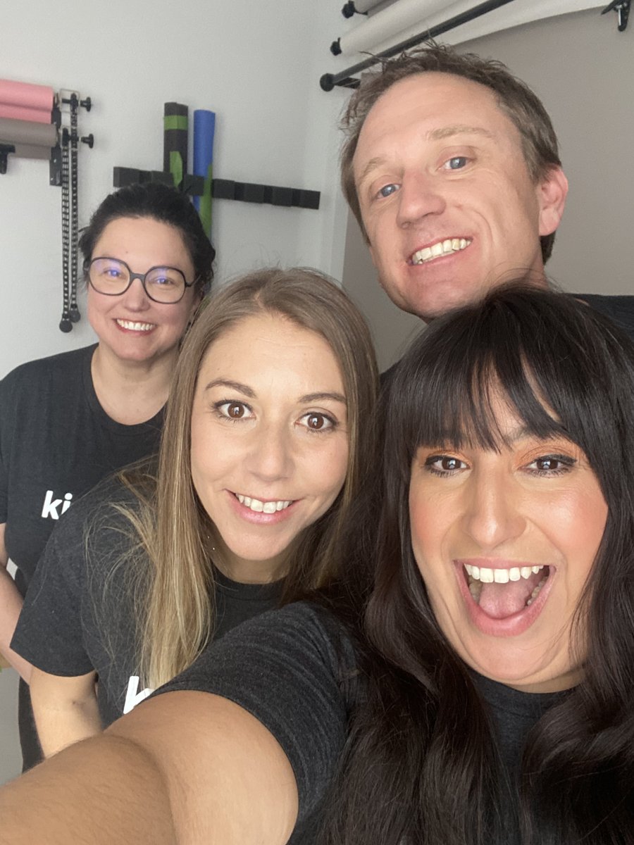 Jennifer taking a selfie with Brent Daily and two Kinspire teammates, all in Kinspire T-shirts